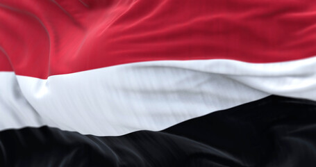 Close-up view of the Yemen national flag waving
