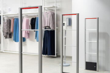 Close up anti-theft system in a clothing store. Entrance gate with scanner to prevent theft