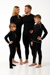 Sports family in thermal clothes, on a white background.