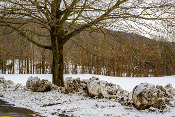Snow is pushed to the edge of the parking lot at Windsor High School in Upstate NY.  The parking...