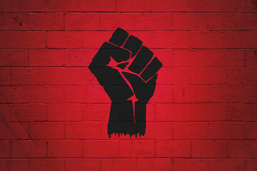 Fist power painted on a wall