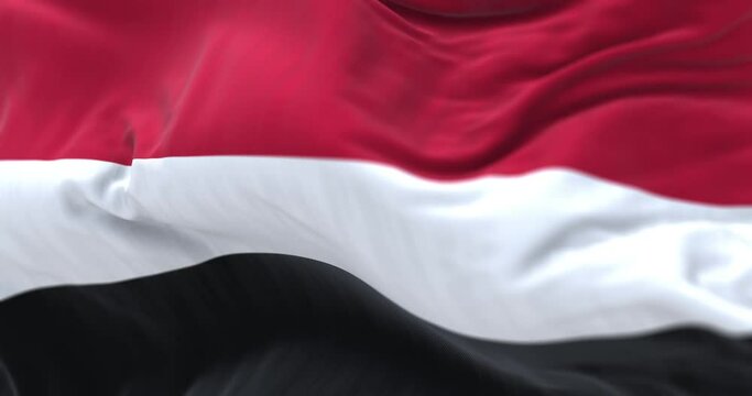 Close-up view of the Yemen national flag waving