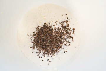 Mixing dry and liquid ingredients for chocolate ice cream top view. High quality photo