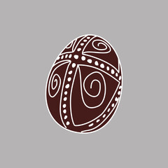 Hand drawn Easter egg with white lines on a brown background. Ethnic traditional motif ukrainian national pattern swirls
