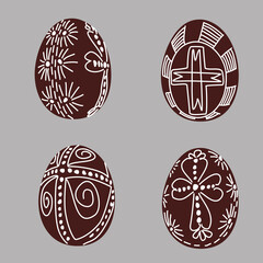 Hand drawn Easter egg with white lines on a brown background. Ethnic traditional motif ukrainian national pattern swirls
