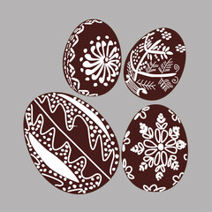 Hand drawn Easter egg with white lines on a brown background. Ethnic traditional motif ukrainian national pattern swirls
