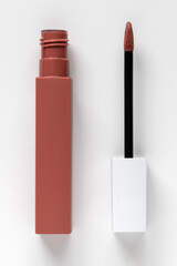 Liquid lipstick open on a white background.