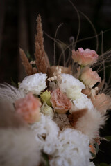 Beautiful wedding bouquet in vintage style. Boho bridal bouquet composed of lisianthus, pampas...