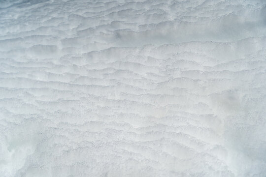 Overlapping snow until it becomes a layer of ice crystals