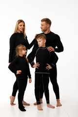 Sports family in thermal clothes, on a white background.