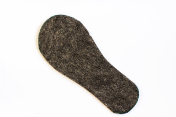 Felt grey insole on a white background