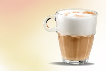 Tasty aroma coffee in a glass cup on the background