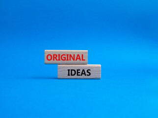 Original ideas symbol. Concept word Original ideas on wooden blocks. Beautiful blue background. Business and Original ideas concept. Copy space.