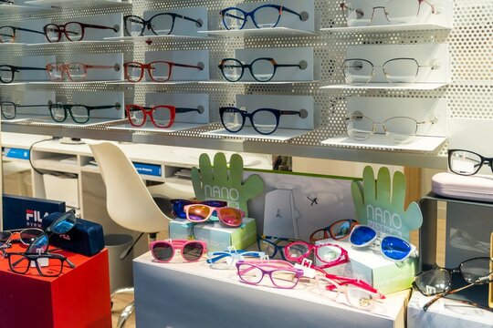 Barcelona, Spain - February 17, 2022. Shop window of an optician's in which glasses and other items related to sight and hearing are exhibited.