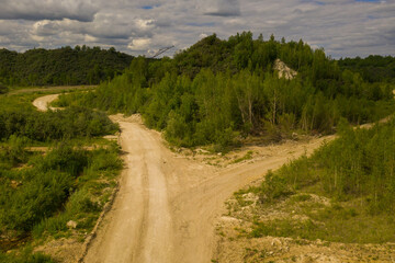 Fototapeta na wymiar Drone photography of old abandoned quarry and nature taking it back