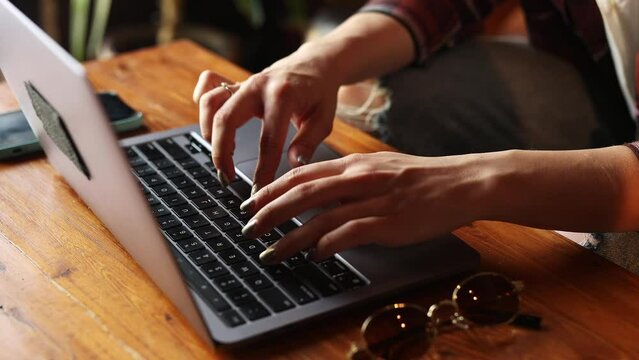 Female hands texting on laptop keyboard close up. Software, online education, apps, modern tech concept