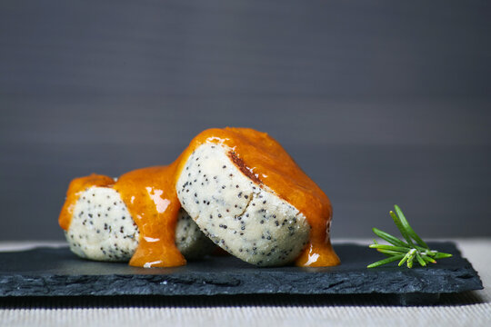 Vegan food cutlets breakfast gluten free healthy dinner served on the plain black stone plate with fruit sauce