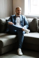 portrait of smiling groom with beard