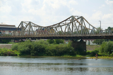 Fototapeta premium Old metal bridge across Dniester river in the city of Halych, western Ukraine