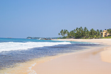 Beautiful view of the tropical beach of Sri Lanka on a sunny day