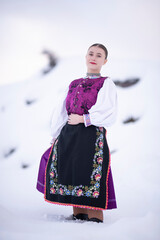 Young beautiful slovak woman in traditional costume. Slovak folklore