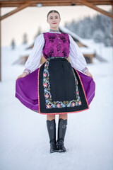 Young beautiful slovak woman in traditional costume. Slovak folklore