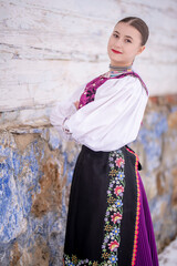 Young beautiful slovak woman in traditional costume. Slovak folklore