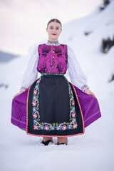 Young beautiful slovak woman in traditional costume. Slovak folklore