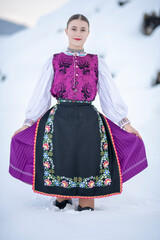 Young beautiful slovak woman in traditional costume. Slovak folklore