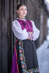 Young beautiful slovak woman in traditional costume. Slovak folklore