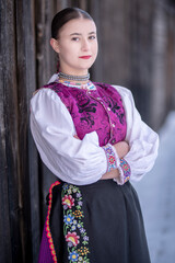 Young beautiful slovak woman in traditional costume. Slovak folklore
