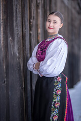 Young beautiful slovak woman in traditional costume. Slovak folklore