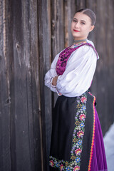 Young beautiful slovak woman in traditional costume. Slovak folklore