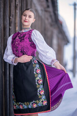 Young beautiful slovak woman in traditional costume. Slovak folklore