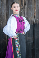 Young beautiful slovak woman in traditional costume. Slovak folklore
