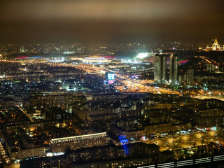Fototapeta na wymiar aerial view of Moscow city with Moscow State University, Luzhniki Stadium at night from Imperia Tower of Moscow-City district, Russia