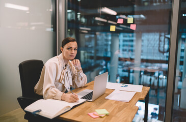 Focused executive working on project in office