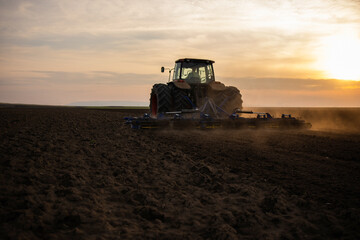 Farmer preparing his field in a tractor