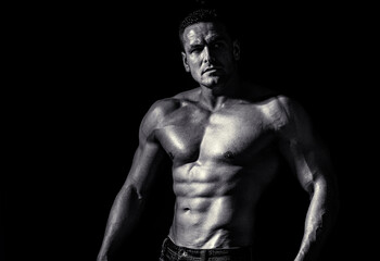 Fototapeta na wymiar Muscular sexy man. Handsome sexual strong man with muscular body. Black and white