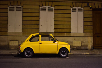 Small Yellow Old Timer Car in Paris, France