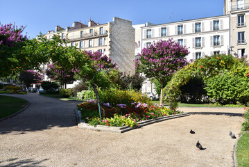 Park and Traditional Parisian Apartment Buildings at Place d’Italie in Paris, France