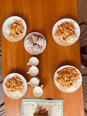 school lunch table with pasta, bun and milk
