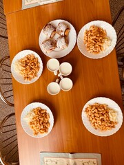 school lunch table with pasta, bun and milk