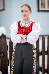 Young beautiful slovak woman in traditional costume. Slovak folklore