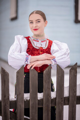 Young beautiful slovak woman in traditional costume. Slovak folklore