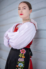 Young beautiful slovak woman in traditional costume. Slovak folklore