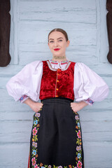 Young beautiful slovak woman in traditional costume. Slovak folklore