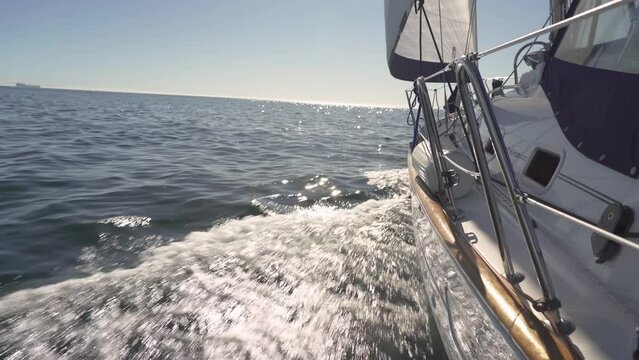 Yacht sailing boat vessel on the ocean on a sunny day, travel adventure 