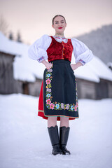 Young beautiful slovak woman in traditional costume. Slovak folklore