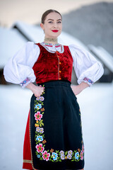 Young beautiful slovak woman in traditional costume. Slovak folklore